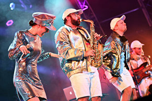 Members of the French electro swing band Lamuzgueule (LMZG) Déborah Reboul, Salvatore Virgone and Romain Deschamps (left to right) performing at the 17th Koktebel Jazz Party international festival